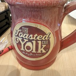 Toasted Yolk offers their gourmet coffee in these mugs with a selection of unique creamers and sweeteners. Toasted Yolk offers their gourmet coffee in these mugs with a selection of unique creamers and sweeteners.