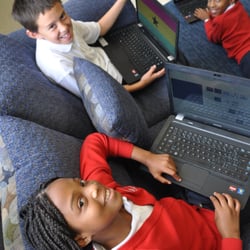 Olivet School - In the older grades, students are provided with laptops for some in school assignments.