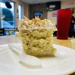 Tres leches topped with cream and cinnamon Tres leches topped with cream and cinnamon