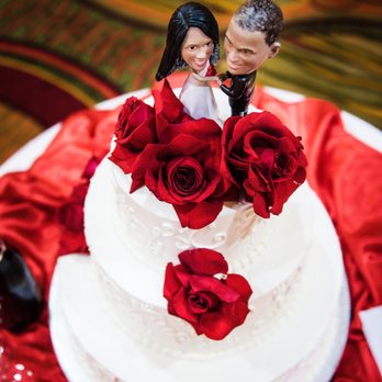 Elegant Event Creations - She decorated the table and added beautiful red roses around our Wedding Cake! - Wedding Planning Near Me Elegant Event Creations - She decorated the table and added beautiful red roses around our Wedding Cake! - Wedding Planning Near Me