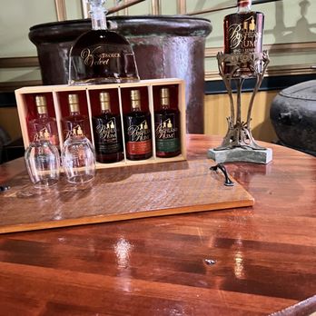 Richland Rum - a wooden table with wine glasses on it - Distilleries Near Me - Richland, Georgia Richland Rum - a wooden table with wine glasses on it - Distilleries Near Me - Richland, Georgia