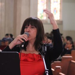 Blessed Sacrament - A worship director leads the choir.