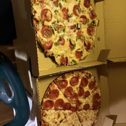 High Rolls General Store - Pepperoni/cheese pizza and pepperoni, mushroom, bell pepper and pineapple pizza