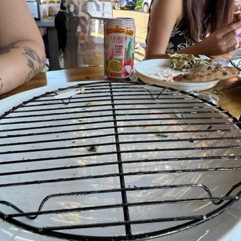 Hapa Pizza - Serving plate with wire rack. Coating is flaking off - Pizza Near Me - Beaverton, Oregon Hapa Pizza - Serving plate with wire rack. Coating is flaking off - Pizza Near Me - Beaverton, Oregon
