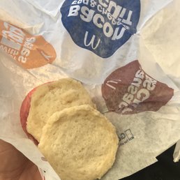 a hand holding a bag of cookies
