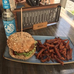 Lenok's Burger - Vegan burger made with chia seeds and cauliflower with a side of sweet potatoes fries