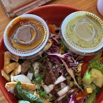 Tokyo Joe's - Steak bowl with red dragon and green dragon sauces on the side for an extra kick of heat in your mouth. - Sushi Bars Near Me - Greeley, Colorado