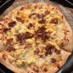 a pizza with cheese and bacon a pizza with cheese and bacon