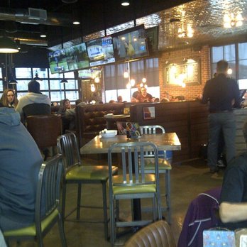 Beertown - Burlington - The dining area has a mix of different style chairs and tables. There are also booths. It has a cheerful & fun atmosphere. - Beer Bar Near Me - Burlington, Ontario Beertown - Burlington - The dining area has a mix of different style chairs and tables. There are also booths. It has a cheerful & fun atmosphere. - Beer Bar Near Me - Burlington, Ontario