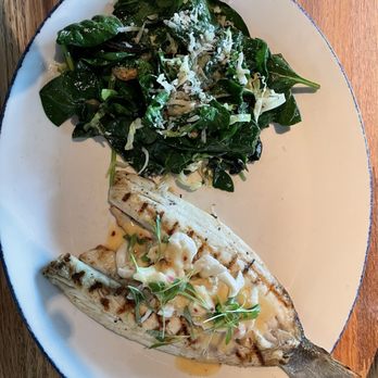 Pacific Table - Branzino fish topped with crab meat and sautéed spinach - Seafood Near Me - Irving, Texas Pacific Table - Branzino fish topped with crab meat and sautéed spinach - Seafood Near Me - Irving, Texas