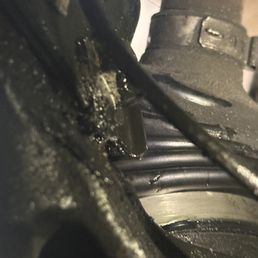 Damaged boot and mark that perfectly aligns with shock mount.