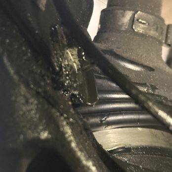 Arcadia Service Center - Damaged boot and mark that perfectly aligns with shock mount. - Auto Repair Near Me - Arcadia, California