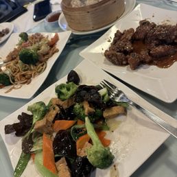 Honey Garlic Ribs, vegetables with crispy tofu, chicken chow mein, soup dumplings. Honey Garlic Ribs, vegetables with crispy tofu, chicken chow mein, soup dumplings.