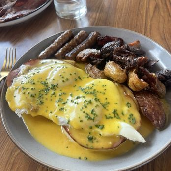 Birdy's Finer Diner - The OG Benedict with a side of sausage. The most delicious crispy potatoes and hollandaise sauce you have ever had in your life. - Desserts Near Me - Moab, Utah Birdy's Finer Diner - The OG Benedict with a side of sausage. The most delicious crispy potatoes and hollandaise sauce you have ever had in your life. - Desserts Near Me - Moab, Utah