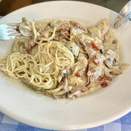 Veal Anconna Spaghetti Special (mushrooms, sundried tomatoes, and artichoke hearts) in a cream sauce.