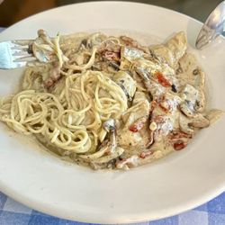 Anconna Italian Restaurant - Veal Anconna Spaghetti Special (mushrooms, sundried tomatoes, and artichoke hearts) in a cream sauce.