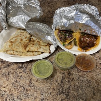 Taqueria Extra - Here is a picture of what I got home with originally not the super burrito - Mexican Near Me - Pleasanton, California