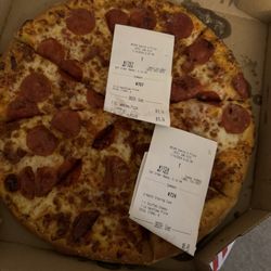 Domino's Pizza - Opened my pizza box and they had receipt papers on my pizza... That's so nasty!!!