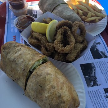 Flo's Luncheonette - Bates burger wrap with bacon cheese lettuce and waffle fries inside  ..an order of calamari and a chicken wrap all good stuff - American Near Me - Blue Point, New York