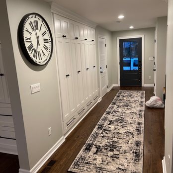 Dayson's Home Improvements - a hallway with a clock on the wall - General Contractors Near Me - Upper Saddle River , New Jersey