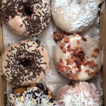 Duck Donuts - In all their glory (orange and choc sprinkles, French toast, maple bacon, strawberry coconut, almond joy, PB and choc sprinkles) - Donuts Near Me - Rockville, Maryland Duck Donuts - In all their glory (orange and choc sprinkles, French toast, maple bacon, strawberry coconut, almond joy, PB and choc sprinkles) - Donuts Near Me - Rockville, Maryland