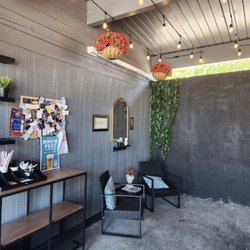 Some seating, decor and a community activity board.