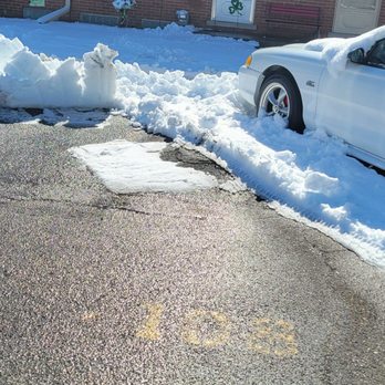 Kramer-Triad Management Group - Snow piled blocking access to sidewalk. - Property Management Near Me - Ann Arbor, Michigan
