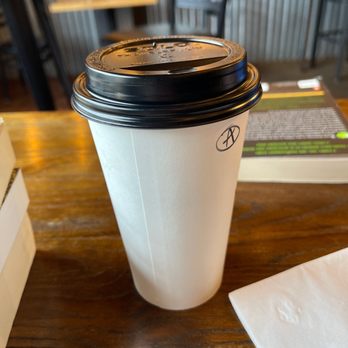 Moka Joe Coffee - a coffee cup on a table - Coffee Roasteries Near Me - Anacortes, Washington Moka Joe Coffee - a coffee cup on a table - Coffee Roasteries Near Me - Anacortes, Washington