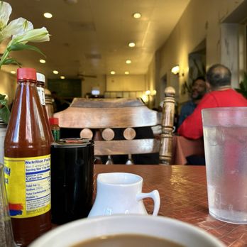 Sweet Maple Cafe - a cup of coffee and a vase of flowers - American Near Me - Chicago, Illinois