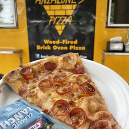 a slice of pizza on a plate