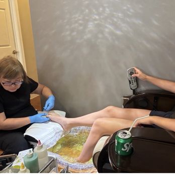Vivians Nail Spa - Distracted technician watching her phone while performing a pedicure - Nail Salons Near Me - Montclair, Virginia Vivians Nail Spa - Distracted technician watching her phone while performing a pedicure - Nail Salons Near Me - Montclair, Virginia