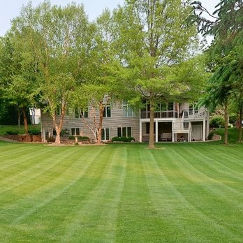 YARDS by Wes - a large lawn with a house in the background - Landscaping Near Me YARDS by Wes - a large lawn with a house in the background - Landscaping Near Me