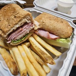 Scooters Cafe & Pizzeria - Club sandwich plus fries.
