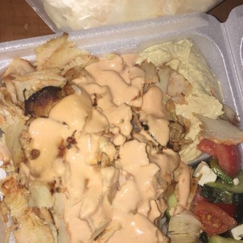 Garlic 'n Lemons - Spicy chicken over rice, greek salad, and hummus with spicy garlic sauce. Comes with free pita! - Middle Eastern Near Me - Boston, Massachusetts