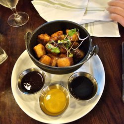 Our Table - Pork belly with three sauces.