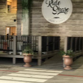 Whistle Britches - Plano - Ride share seating area in the parking garage - American Near Me - Plano, Texas Whistle Britches - Plano - Ride share seating area in the parking garage - American Near Me - Plano, Texas