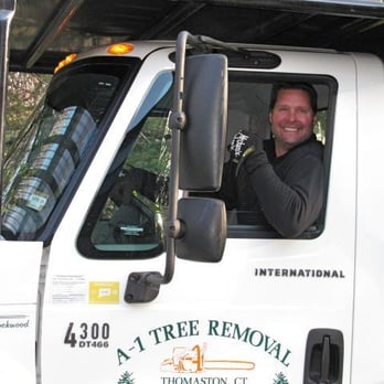 A-1 Tree Service - a smiling man driving a tree removal truck - Tree Services Near Me - Thomaston, Connecticut A-1 Tree Service - a smiling man driving a tree removal truck - Tree Services Near Me - Thomaston, Connecticut