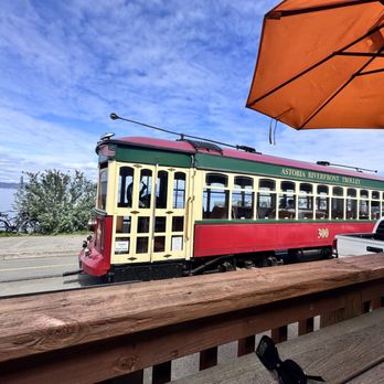 Astoria Brewing Company - The trolley goes by right in front of the outside patio - Seafood Near Me - Astoria, Oregon Astoria Brewing Company - The trolley goes by right in front of the outside patio - Seafood Near Me - Astoria, Oregon
