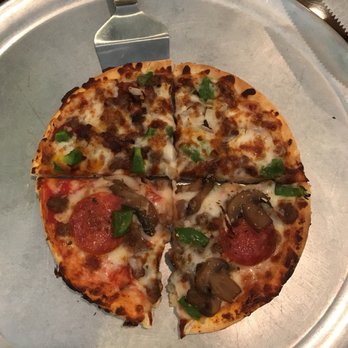 Andrey Mexican Grill & Pizza - a pizza on a pizza pan - Pizza Near Me - Marion, Arkansas Andrey Mexican Grill & Pizza - a pizza on a pizza pan - Pizza Near Me - Marion, Arkansas