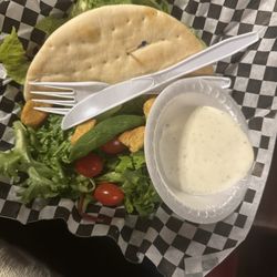Pocket Sandwich Theatre - Grilled chicken pocket sandwich with side salad