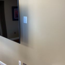 Installed an outlet behind a TV in a conference room. located in Mountain Brook.