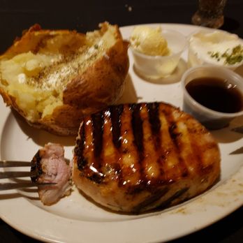 Jones' Black Angus - Tender juicy bourbon glazed pork chop w/ baked potato. - Steakhouses Near Me - Prairie du Chien, Wisconsin Jones' Black Angus - Tender juicy bourbon glazed pork chop w/ baked potato. - Steakhouses Near Me - Prairie du Chien, Wisconsin