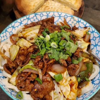 Wild Cumin - Stir-fried lamb over noodles (bottom), bread (top) - Asian Fusion Near Me - Kent, Washington