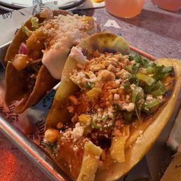 Dirty taco (left), kung pao chicken taco (right) Dirty taco (left), kung pao chicken taco (right)