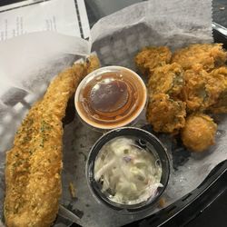 Kingdom Café & Grill - Catfish with coleslaw and hot sauce and a side of fries pickles