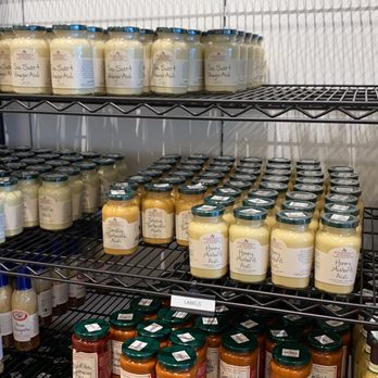 Stonewall Kitchen Outlet - a shelf of jars of sauces and condiments - Home Decor Near Me - Kittery, Maine