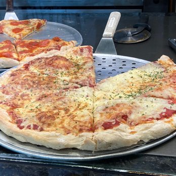 Villa Italian Kitchen - a pizza with cheese and pepperoni - Pizza Near Me - Wauwatosa, Wisconsin Villa Italian Kitchen - a pizza with cheese and pepperoni - Pizza Near Me - Wauwatosa, Wisconsin