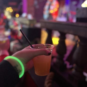 Ballpark Village - Drinks held high Halloween 2024 - Sports Bars Near Me - St. Louis, Missouri