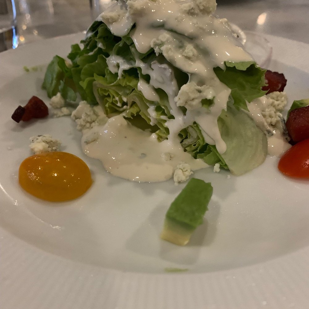Benchmark Restaurant - 1/2 wedge salad that they divided and plated separately for us. - Steakhouses Near Me - Perrysburg, Ohio Benchmark Restaurant - 1/2 wedge salad that they divided and plated separately for us. - Steakhouses Near Me - Perrysburg, Ohio