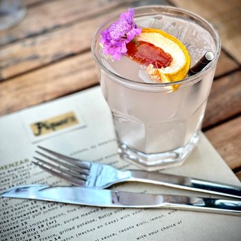 Piqueo's - a grapefruit cocktail with a slice of grapefruit - Latin American Near Me - San Francisco, California Piqueo's - a grapefruit cocktail with a slice of grapefruit - Latin American Near Me - San Francisco, California